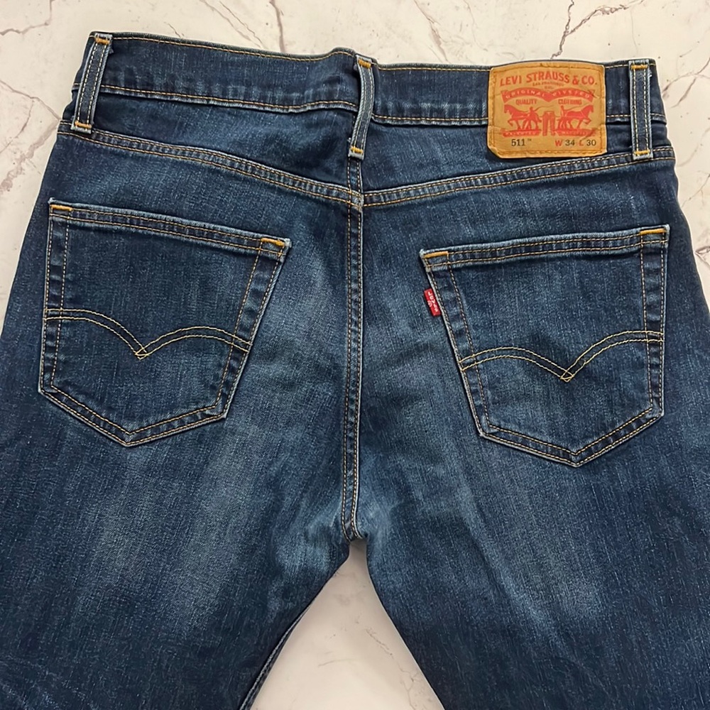 Levi’s Slim 511 size 32x30, dark blue wash jeans.